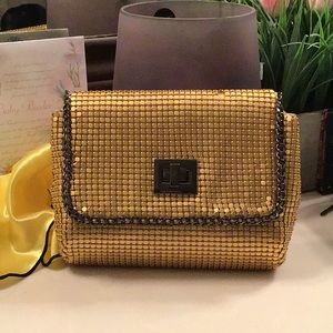 Chain trimmed gold clutch